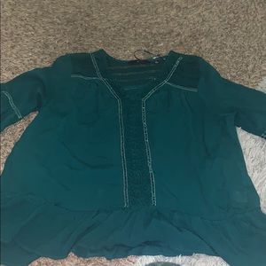 green ruffle bottom blouse